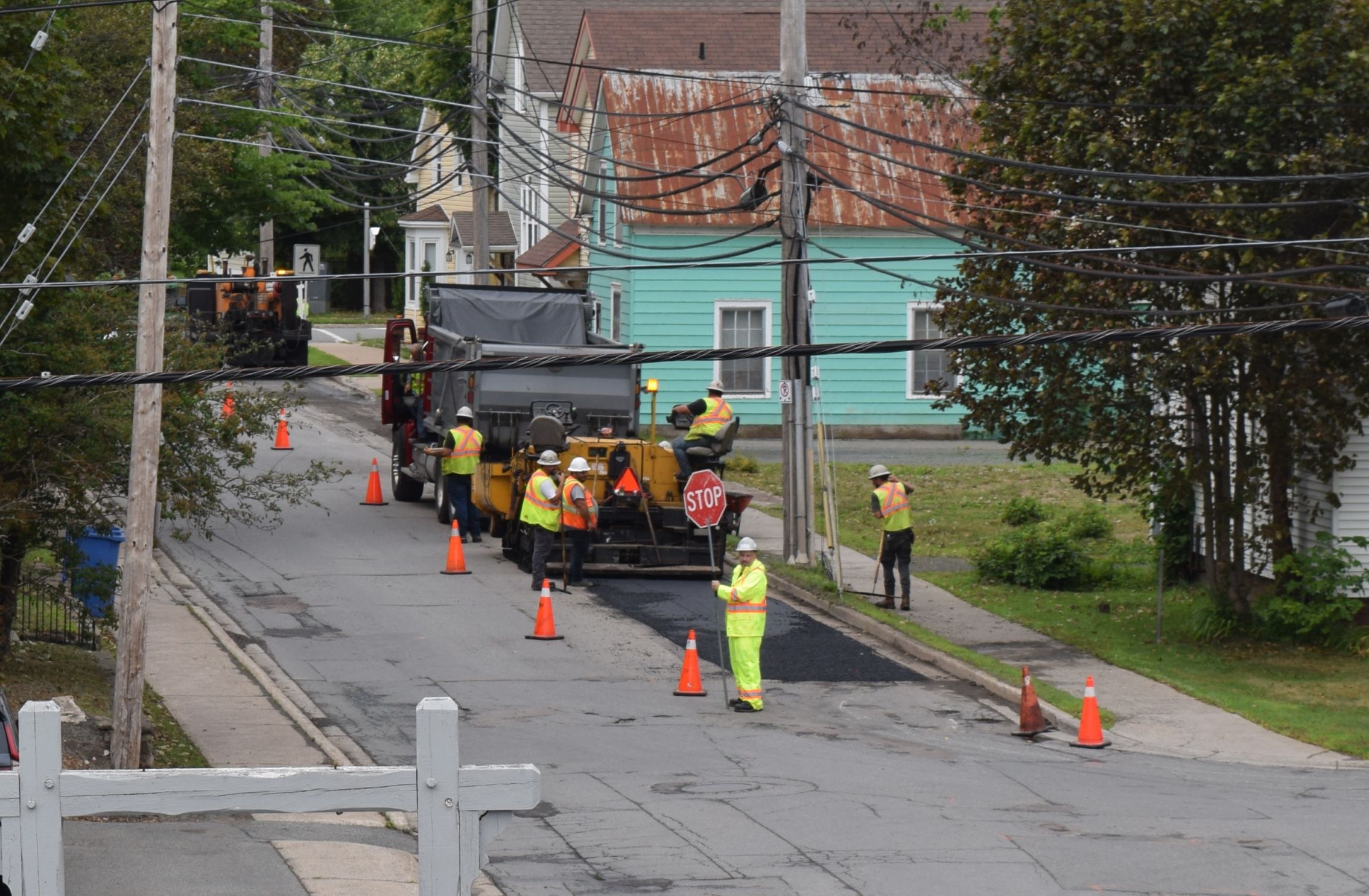 Rooftop view of a planer adding asphalt to a pothole patching project in Antigonish Nova Scotia